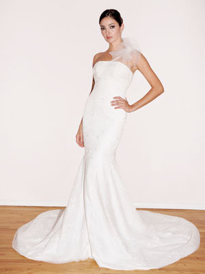 A trumpetstyle gown from Randi Rahm gets an ethereal touch with its 