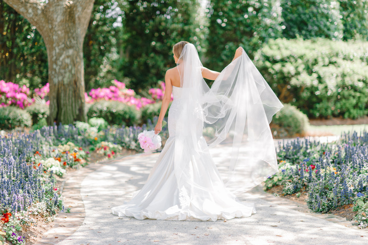 bride walking through garden