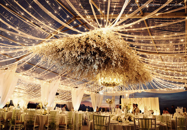 Why We Love It From the suspended flowers to the dramatic draping 