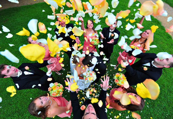 bridal party tossing flower petals