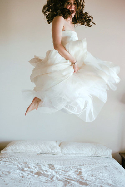 bride jumping on the bed