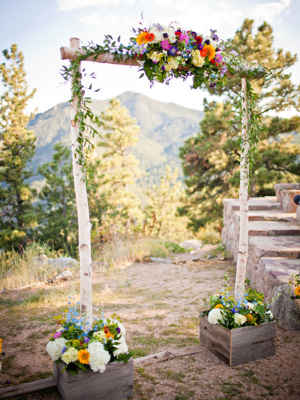 Why We Love It This simple rustic ceremony arch perfectly complements a 