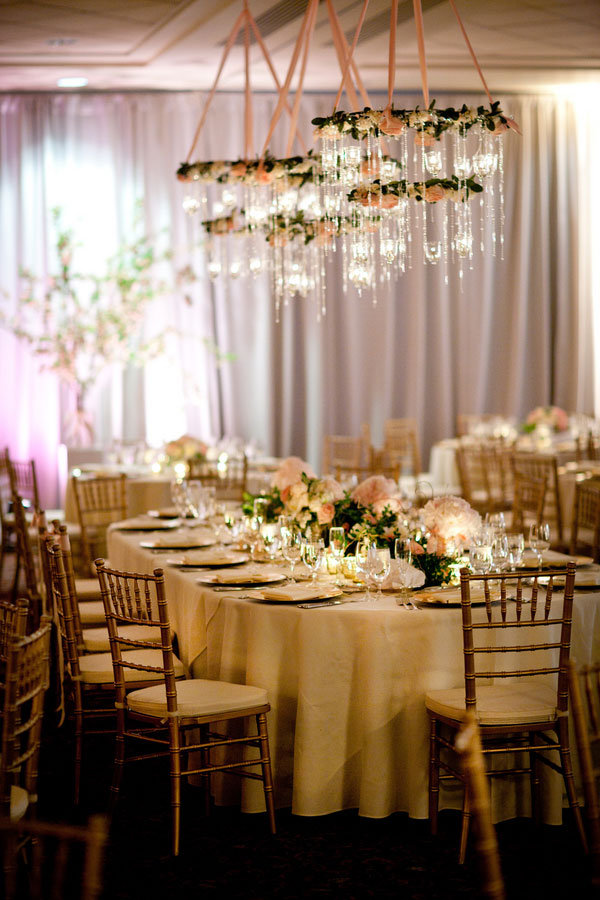 chandeliers with flowers candles and crystals