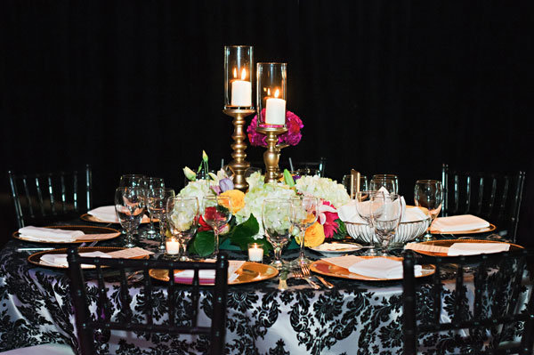 Why We Love It Pairing a simple centerpiece with a dramatic tablecloth 