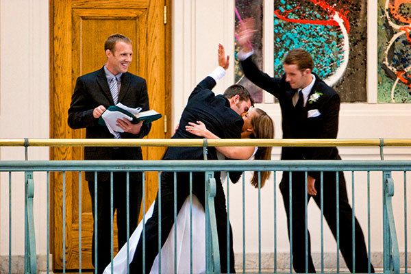 high five from the best man during the first kiss