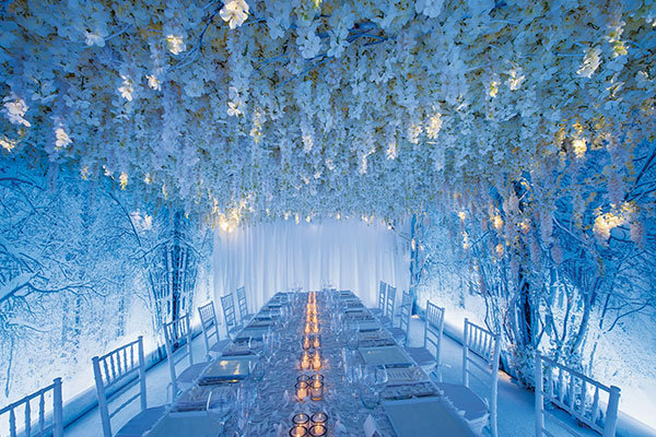 flowers above the tables at wedding reception