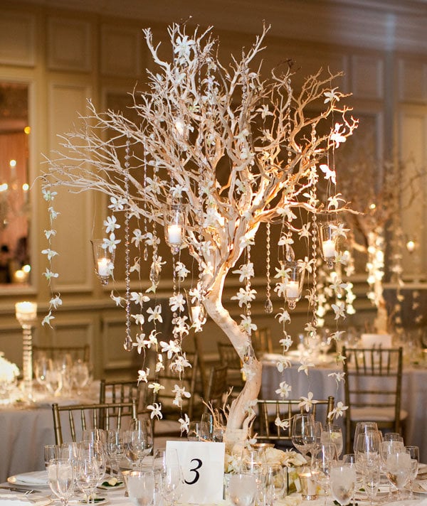 Towering centerpieces perfect for a highceilinged space add drama and 