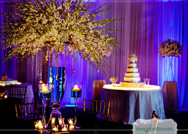 Towering centerpieces perfect for a highceilinged space add drama and 