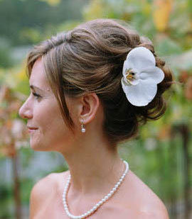elegant side updo with flowers or accessories