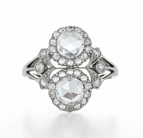 Engagement ring with two rosecut diamonds and accent diamonds in 18K white