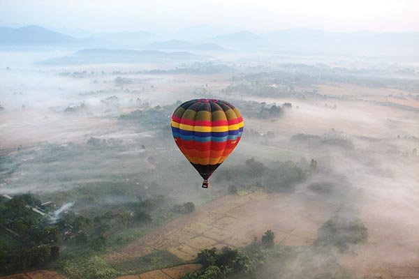 hot air balloon over the jungle of thailand 