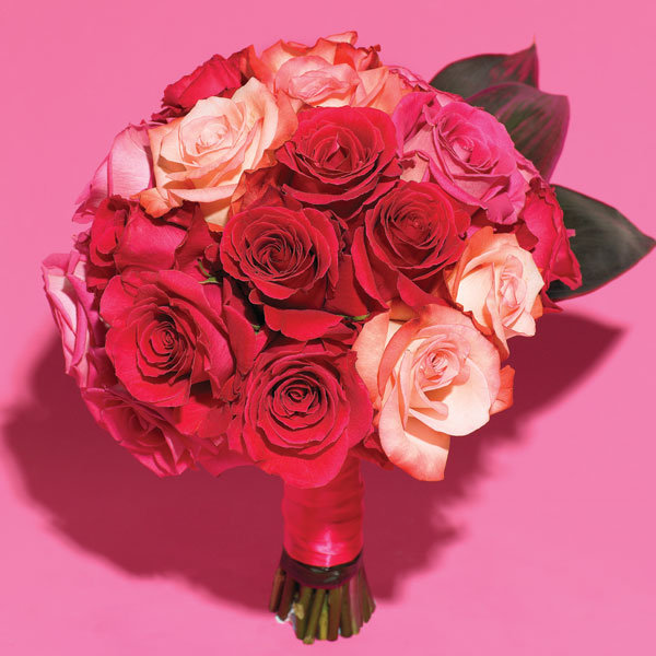 Romance is in the air with this clutch bouquet of assorted roses in blush