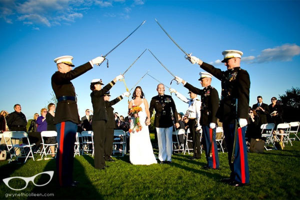Many military weddings include a saber arch under which the bride and groom