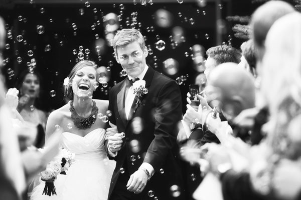 bride and groom with bubbles
