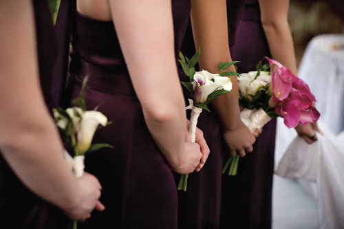Bridesmaids carried delicate calla lily bouquets