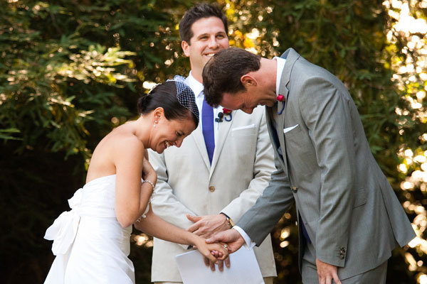 couple laughing at wedding ceremony