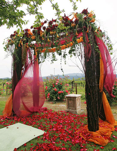 The ceremony arch featured billowing fabric that pooled gracefully on