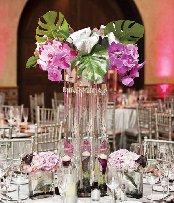 Types of Flowers Sprigs wind up tall vases filled with purple orchids and