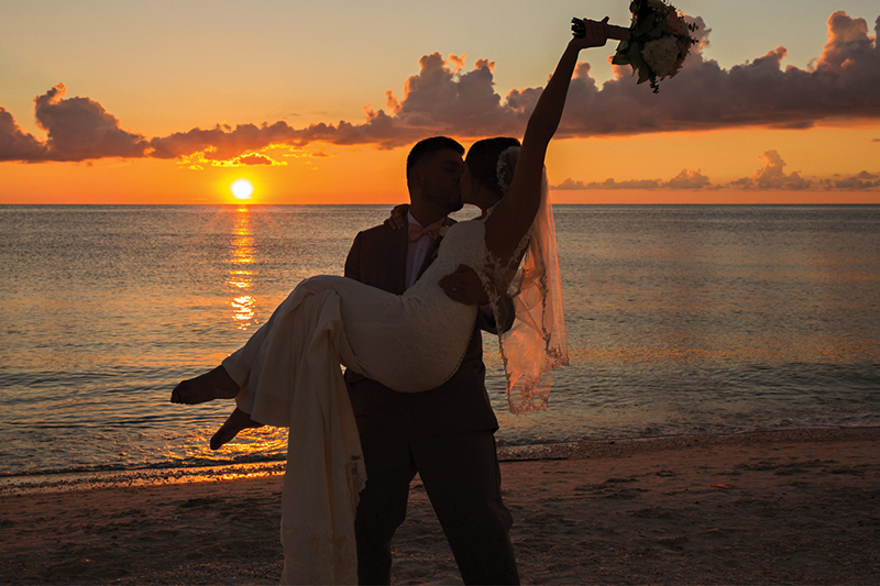 wedding couple at sunset - Naples Beach Hotel