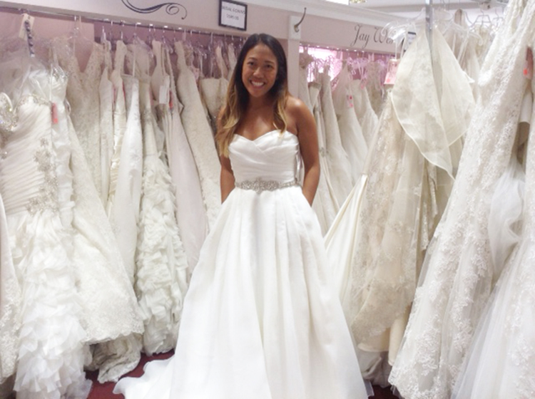 bride in wedding dress and bridal boutique