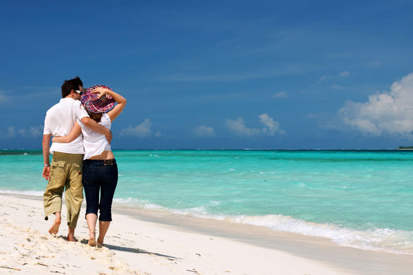 couple on beach for honeymoon 