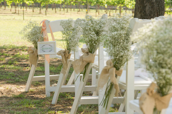 babys breath wedding ceremony decor Photo Credit Jonathan Ivy Photo