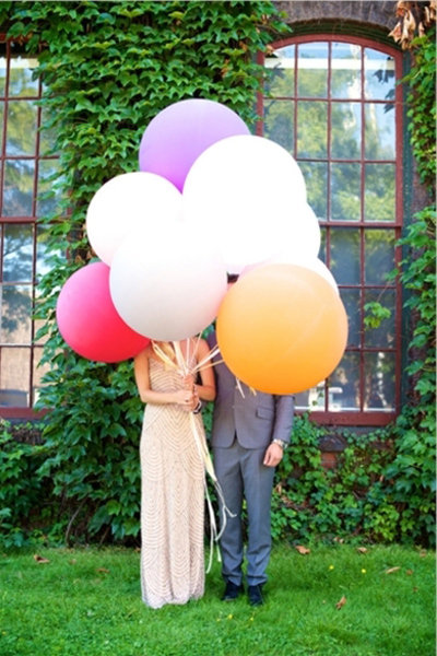 bride and groom with balloons 