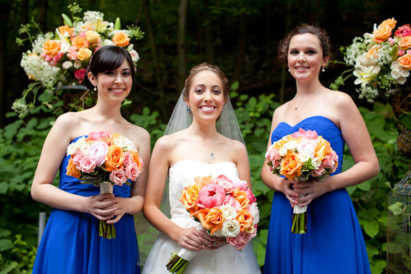 The bridesmaids wore royal blue and the flowers were orange and pink