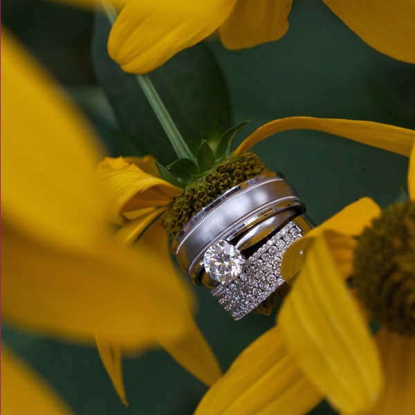 wedding rings with flower Photo Credit Longs Photography