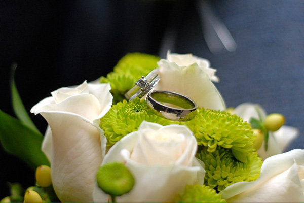 wedding rings with flowers Photo Credit Artistic Impressions