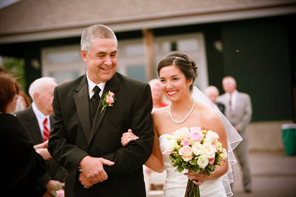 bride walking down aisle with dad