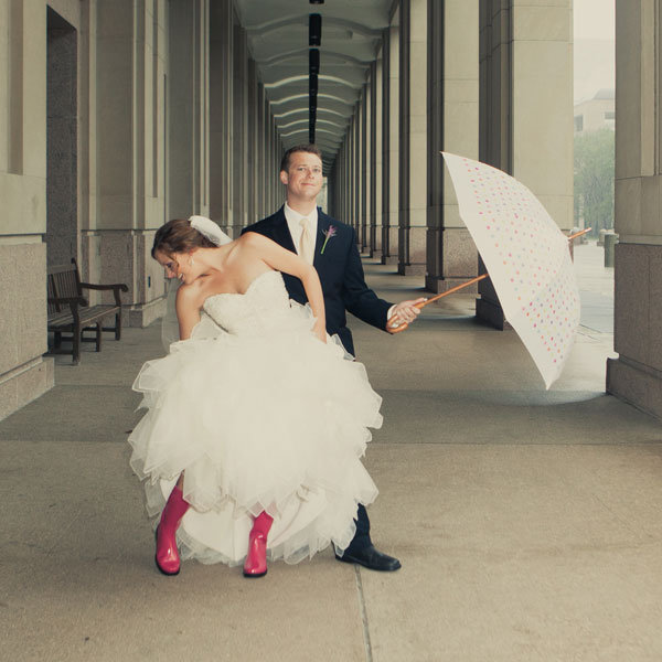 bride and groom wearing rainboots