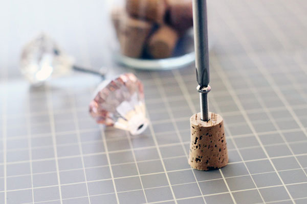 drilling a hole into a bottle cork