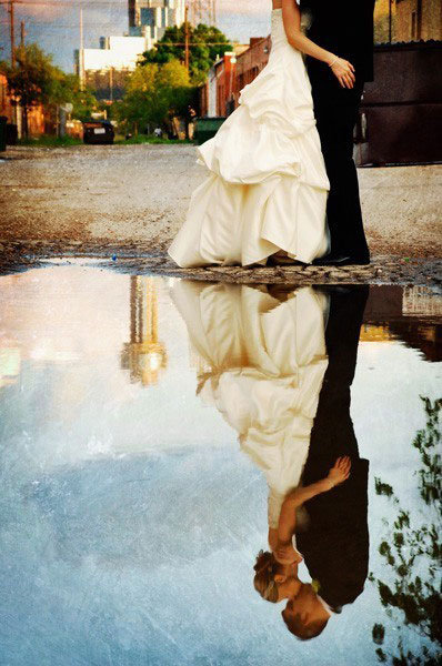 couple reflection in water