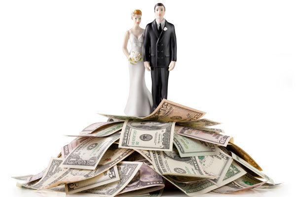 cake topper on top of a pile of money