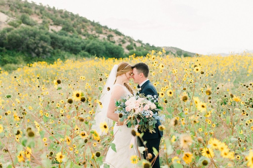 Bride and groom in sunflower field