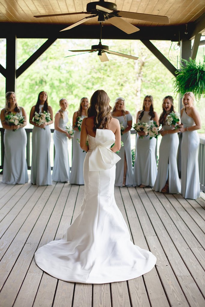 bride first look with bridesmaids