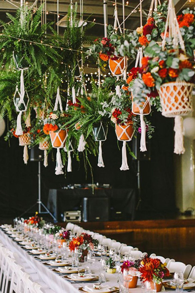 Macrame planters over wedding reception table
