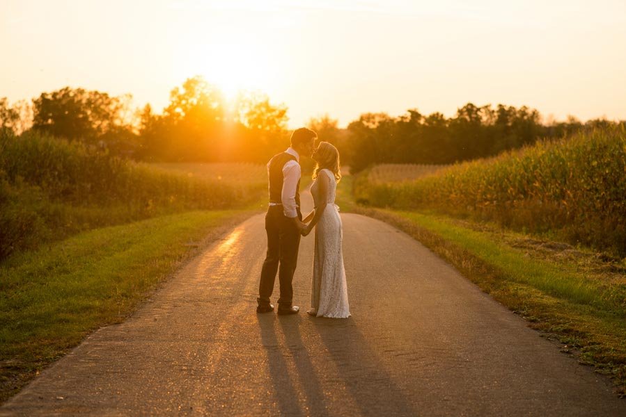 sunset wedding kiss