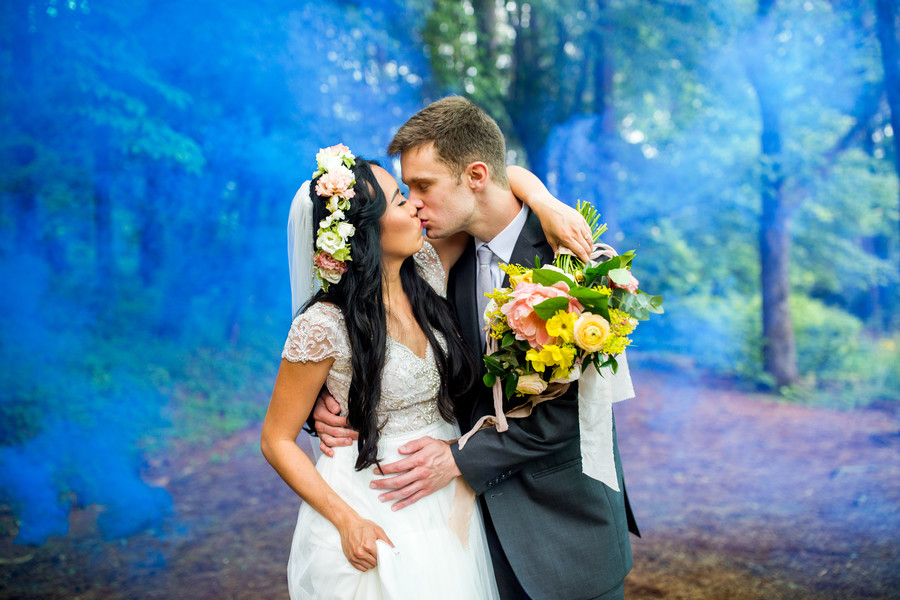 Ethereal wedding photo with blue smoke