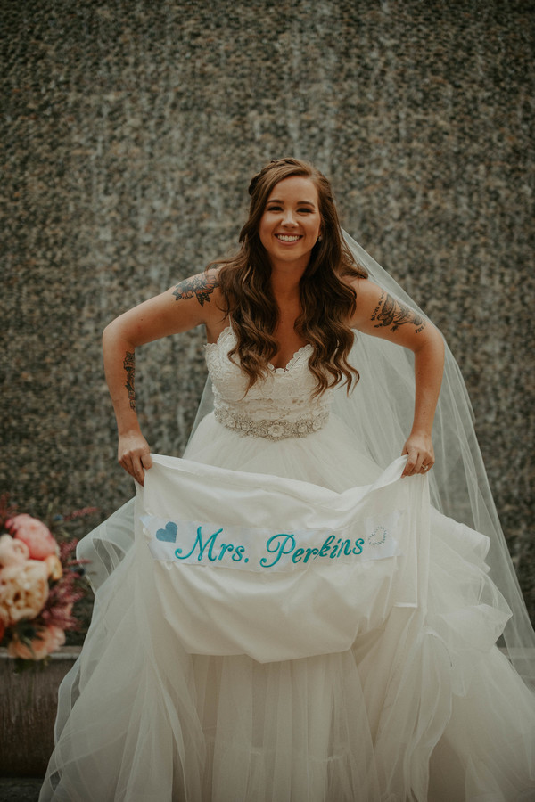 Something blue name sewn into wedding dress