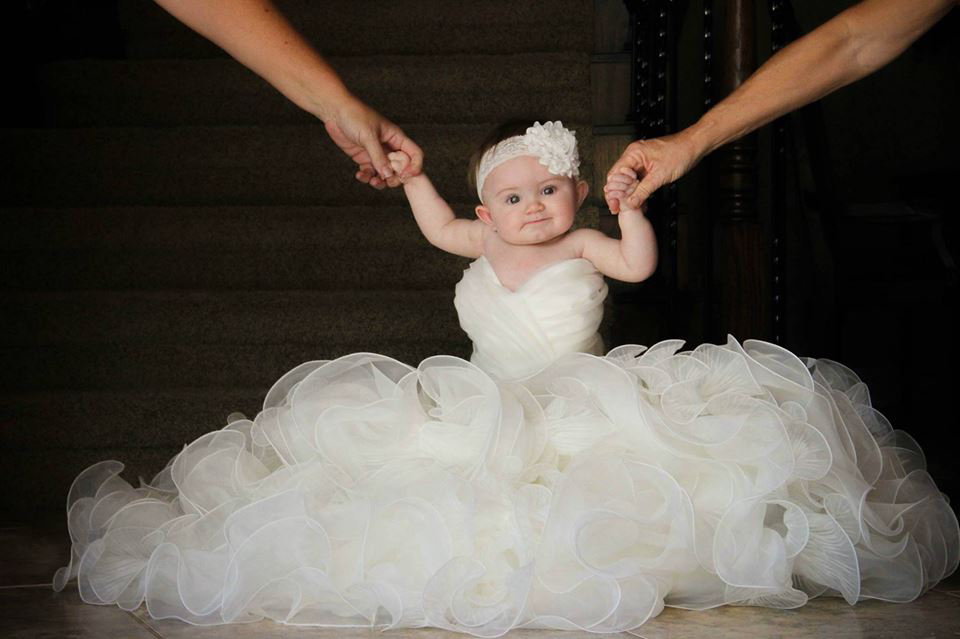 brides daughter in her wedding gown