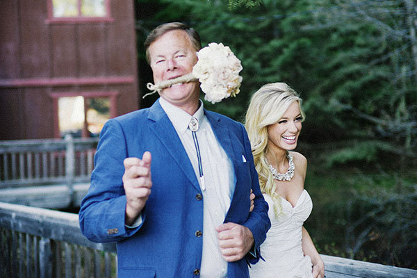 this is how dad helps carry the bouquet