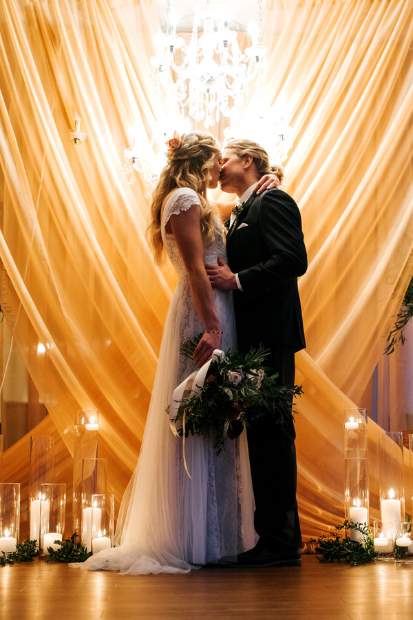 Bride and groom kiss