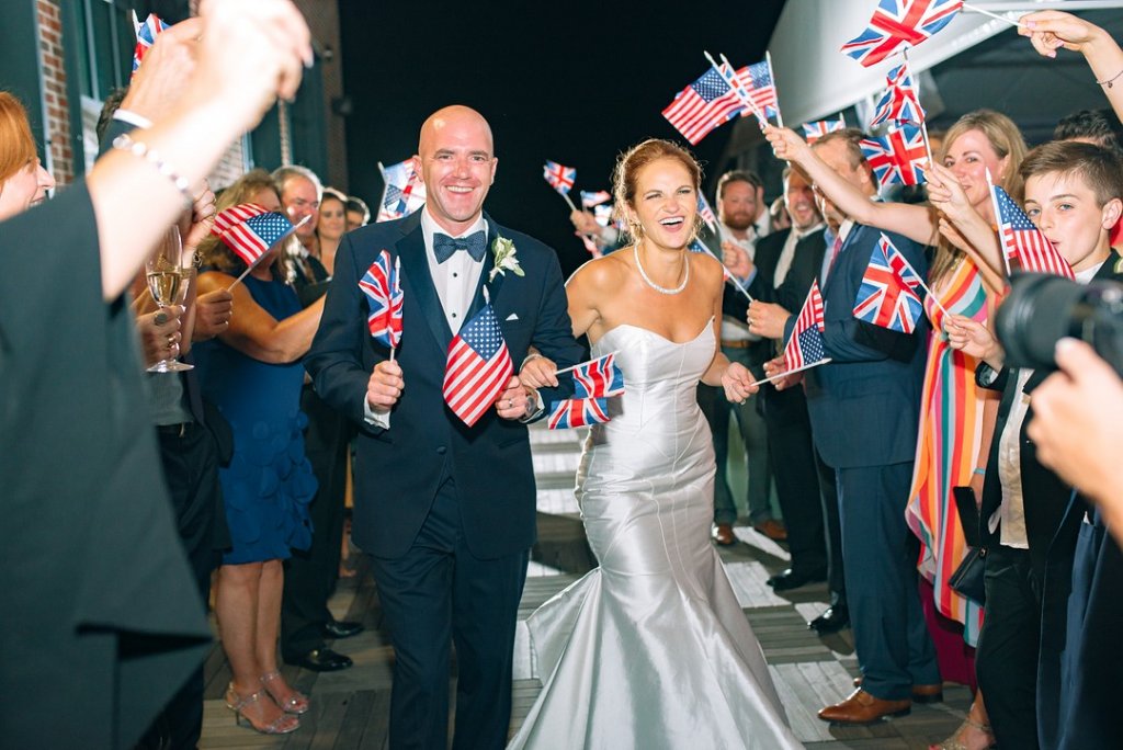 Bride and groom with US and UK flags