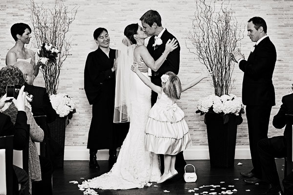 enthusiastic flower girl during the first kiss