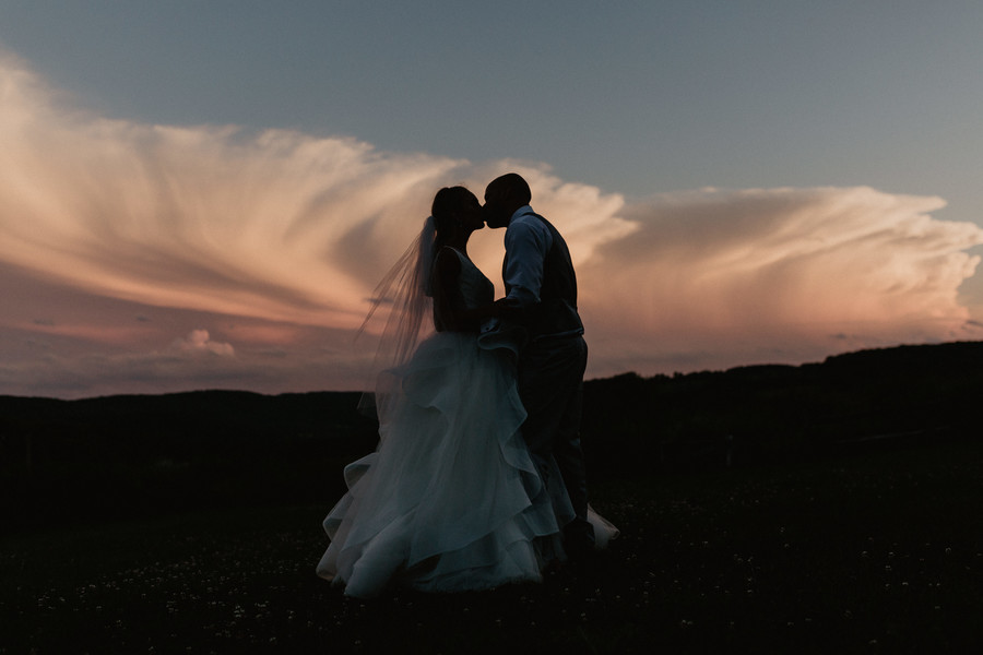 Bride and groom kissing