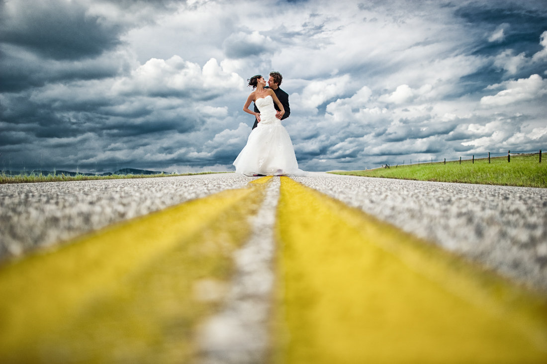 bride and groom in the middle of a street