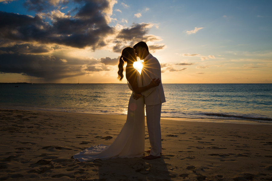 Sunset beach photo of bride and groom