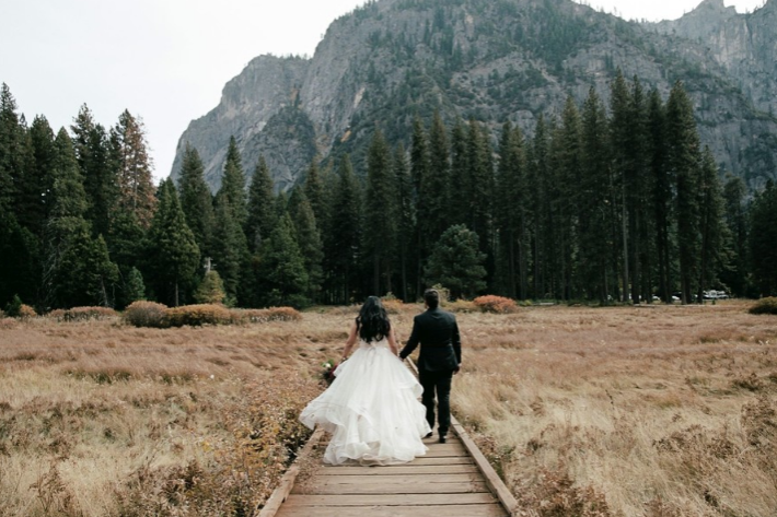 Bride and groom in front of a mountain